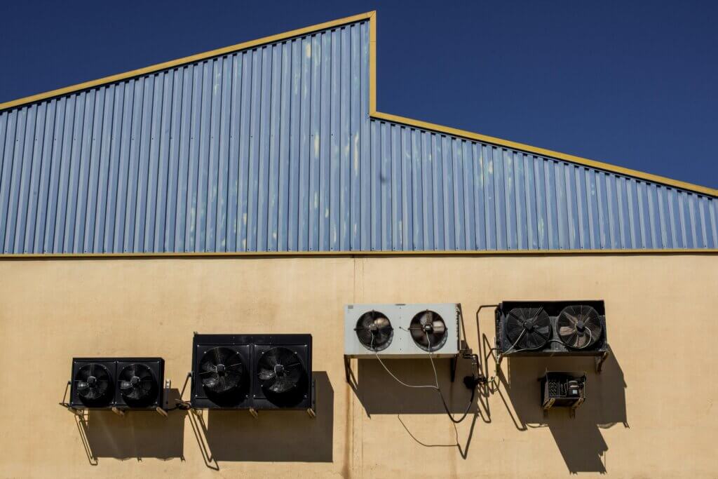 hvac seo services: air conditioning units on wall 2